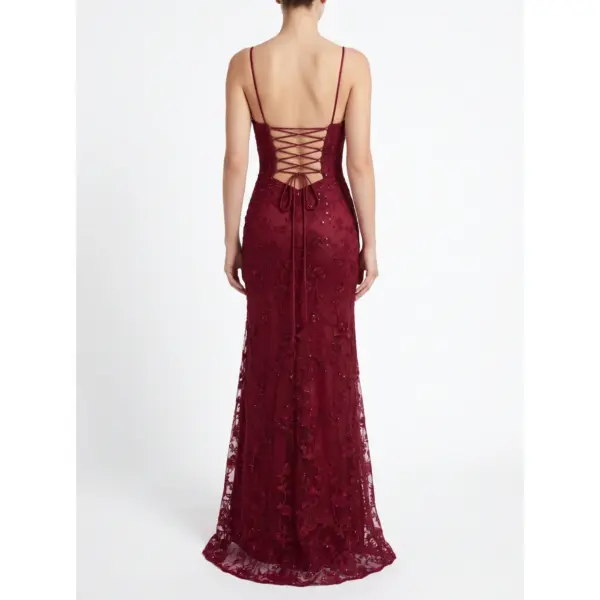 Back view of the Donatella Burgundy Embroidered Tulle Sheath Gown showcasing an open corset-style lace-up back with crisscross straps, intricate embroidered tulle detailing, and a fluid floor-length skirt with high slit.
