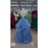 Back view of the Gianna Sky Blue tulle ball gown showcasing a criss-cross lace-up corset back with delicate blue straps, intricate lace appliqué detailing at the waist, and cascading layered ruffles in airy sky blue tulle.